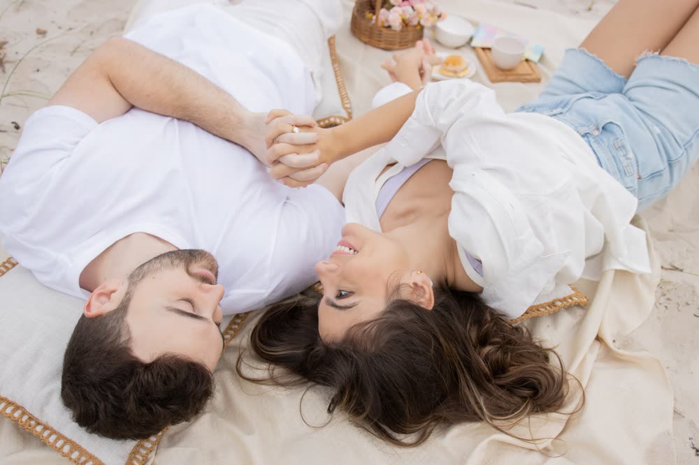 Beatriz and Brenden at a beach picnic